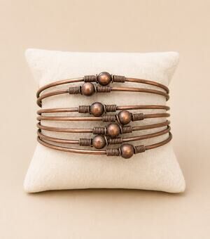 Copper tone multi wire cuff bracelet